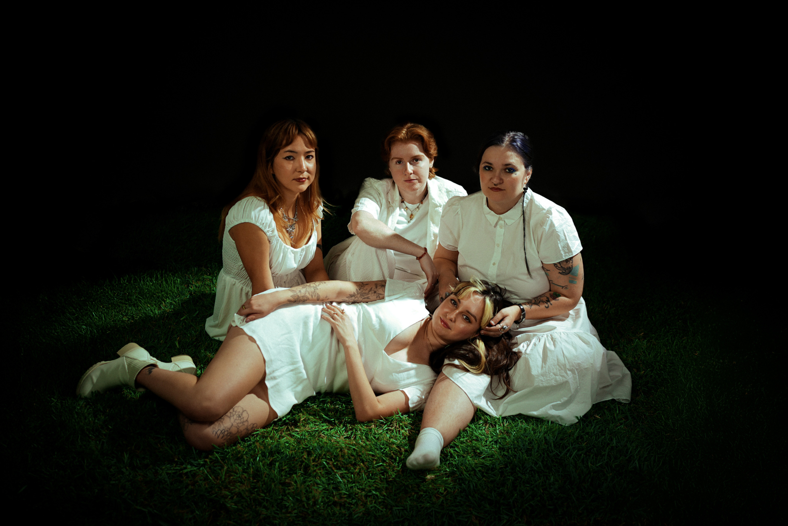 members of keepsake sitting in grass